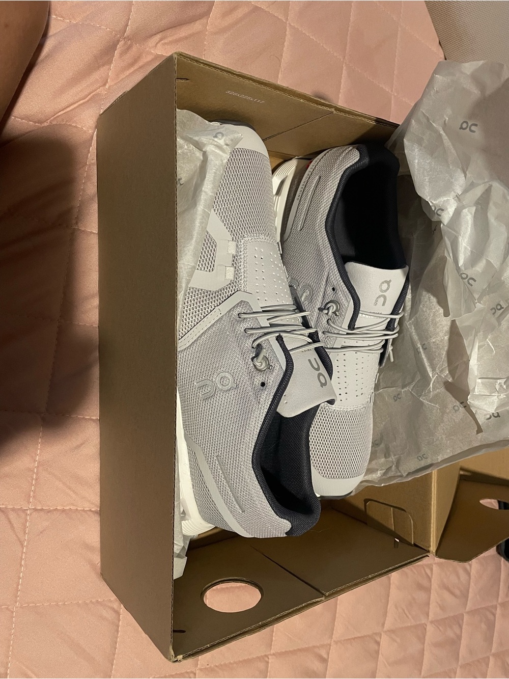 On Running Men’s Light Gray and Black Cloud-Inspired Sneakers